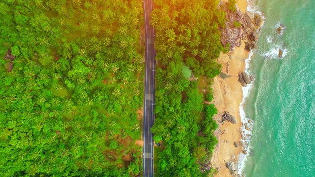 Drones are flying over beautiful beaches, roads and seas. The Gulf of Thailand. The turquoise waters are unique to the tropical seas. many coconut trees. Khanom-Sichon road. Nakhon Si Thammarat, Thail