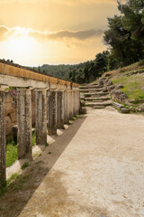 View of the the theatre of Amphiareion at Oropos in Greece against a dramatic sky. A famous touristic destination. 
