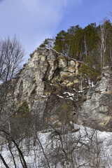 Fototapeta na wymiar Snow-covered gypsum rock outcrop Yermak Stone