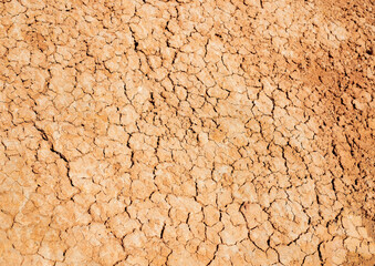Texture of dry bright orange yellow desert soil, abstraction, background
