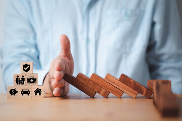 Businessman hand stop wooden block falling to insurance and assurance icon including family health...
