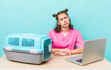 young pretty woman  feeling sad and whiney with an unhappy look and crying. veterinarian concept