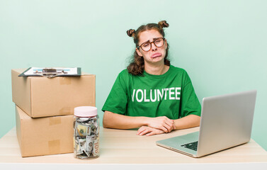 young pretty woman  feeling sad and whiney with an unhappy look and crying. donation volunteer...