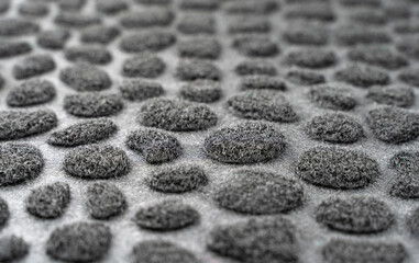 Black and gray spotted background. Textured fur surface