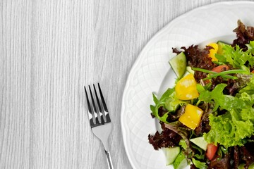 Fresh spring vegetable salad with tomatoes and peppers in the bowl.