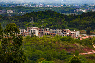 Fototapeta premium Suburban mountain landscape and distant mountains in Nanning, Guangxi, China