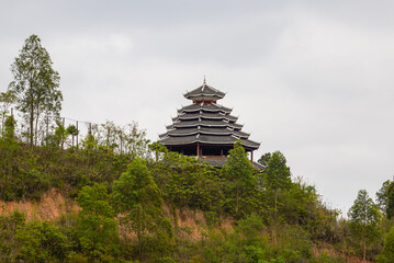 A pavilion in pagoda style of ancient Chinese architecture built on top of a hill
