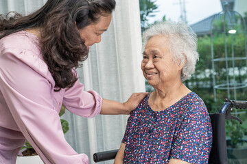 Help and care Asian senior or elderly old lady woman patient sitting on wheelchair at nursing...