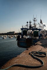 Fishing boats in the dock of Barfleur in France.