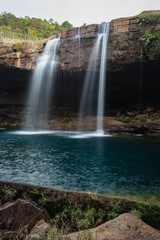 Fototapeta premium waterfall streams falling from mountain top at morning long exposure shot from different angle