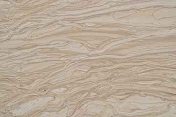 Obraz premium Traces of streams on a flat surface of wet limestone.