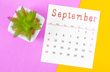 September 2022 calendar on multicolored background.