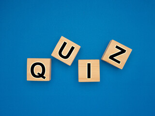 Wooden cubes with the letters QUIZ on a blue background
