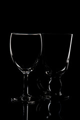 wine glass photographyand  product photography using light effects and low light on a black background
