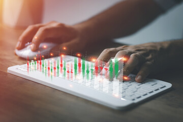 financial and investment technology concept,man's hand using computer to analyze graphs and charts of stock market digital assets gold and oil to be in line with the volatility of the world economy