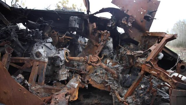 A pile of scrap metal left after the Russian tank. Crushed burned tank.
