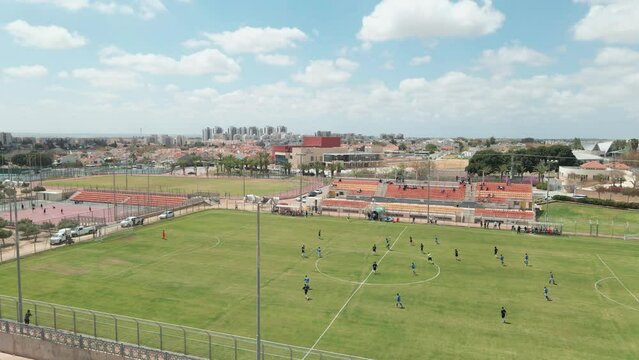 soccer game at noon shot from above at netivot city
