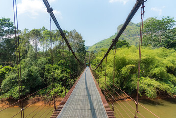 Fototapeta na wymiar suspension bridge over the river