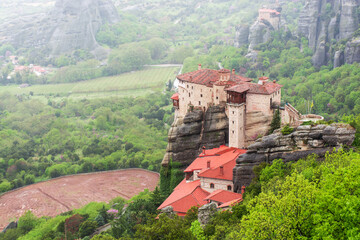 Meteora in Greece, monastery on the background of mountains, cloudy sky