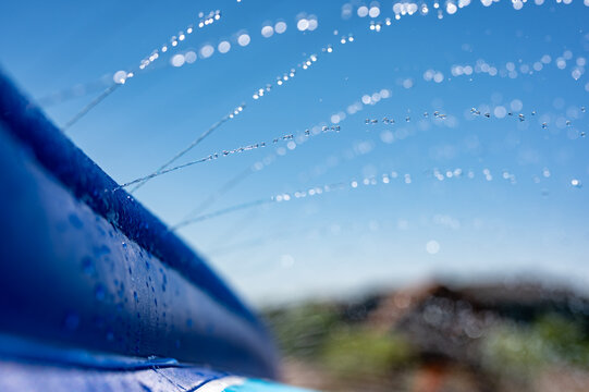 Selective Focus On Jets Of Droplets Shooting Out Across A Water Slide