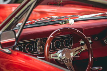 Interior of a red retro car in the parking lot close up