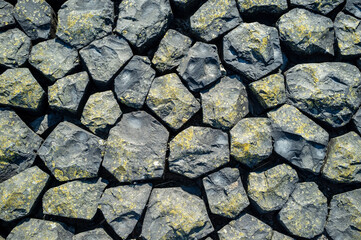 Background from large stones, on a sunny day. Copy space. Top view. 