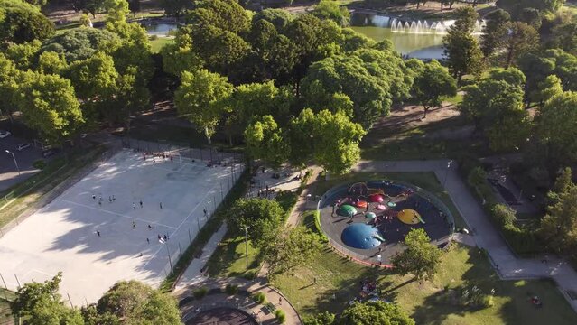 Kids playing at Centenario park of Buenos Aires. Aerial circling