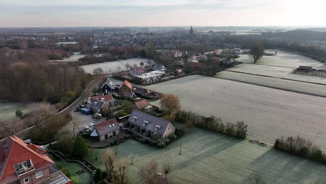 rising aerial images of the village of Oostkapelle in the Dutch zeeland show the beautiful flat land with meadows and beautiful country houses