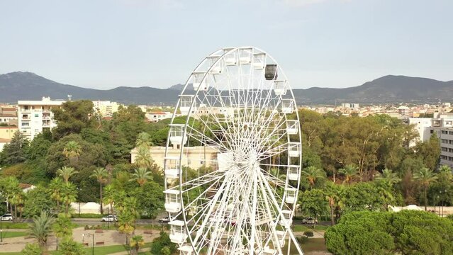 nice flight to a ferris wheel in the park near olbia in sardinia