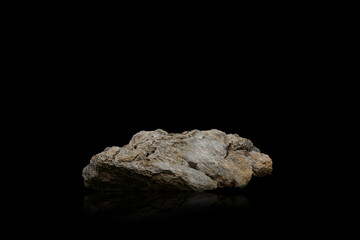 Stone podium on dark black background.