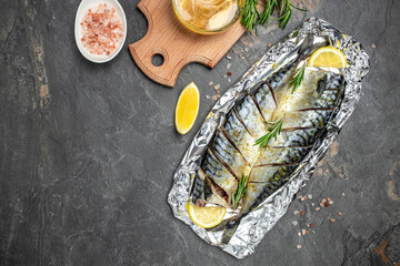 sliced marinated mackerel or herring with lemon and spices. Healthy food, diet or cooking concept....