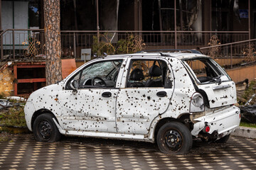 Irpin, Kyev region Ukraine - 09.04.2022: Cities of Ukraine after the Russian occupation. On the streets of Irpin. Shot cars. Irpin, Bucha, Gostomel.