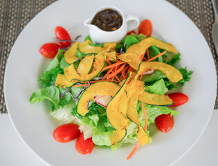 Mixed salad in white plate ,  healthy food, selective focus.