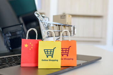 Online shopping, home shopping or product ordering, ecommerce concept : Flag of China, shopping bag...