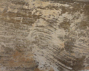 Paint brushed brown wall with detailed texture. A concrete plastered surface background with rough brush strokes.