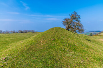 A view along the eastern ramparts of the Iron Age Hill fort remains at Burrough Hill in Leicestershire, UK in early spring
