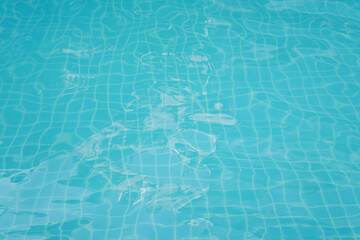 Swimming pool floor with water ripple. Blue texture background.