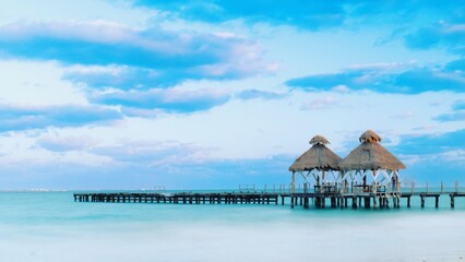 
Calm sea with wooden jetty