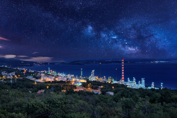 Petrochemical refinery in the night with stars sky. Rijeka. View from Kostrena.