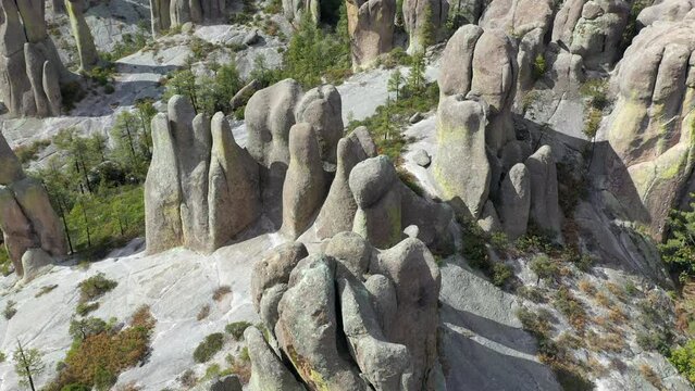 Rock formations of Valle de los Monjes, Chihuahua, aerial tilt up reveal shot