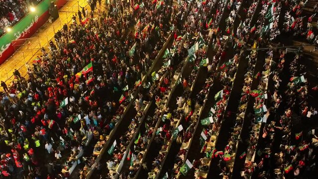 Aerial Overhead Shot Of Crowds Waving Pakistan National Flags At PTI Party Rally In Karachi 