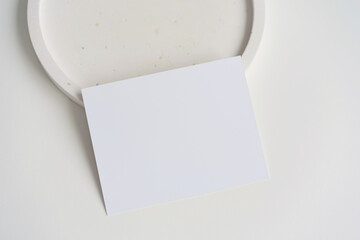 Card mock up on white terrazzo plate, menu mockup, name card, place card
