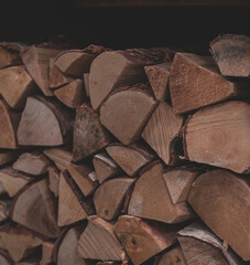 Stack of dry Firewood. Preparation of firewood for the winter. Shallow depth of field.