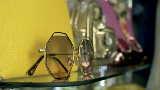 Closeup of sunglasses on the ledge of an optical shop