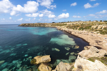 Calcarenite quarries at Cala Azzurra beach. Characteristic limestone landscape of the sea coast of Favignana, (Egadi) Aegadian Islands, Trapani, Sicily, Italy