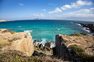 Calcarenite quarries at Cala Rossa beach. Characteristic limestone landscape of the sea coast of...