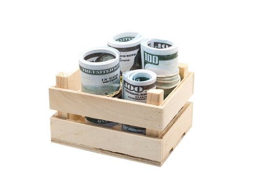 Dollars rolled into a roll and tied with a colored elastic band in a wooden box.