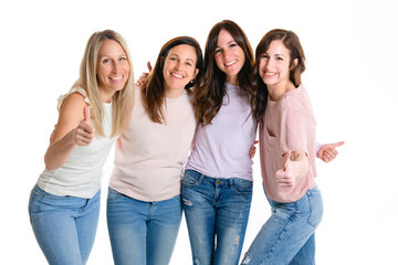 Portrait Of Four best friends Women In Studio Standing with positive thumb up