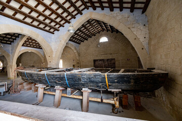Favignana, (Egadi) Aegadian Islands, Trapani, Sicily, Italy - march 15 2022: ancient wooden boats...
