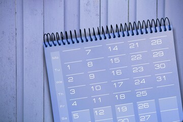 Desktop calendar against paper, 2022. Time and business concept